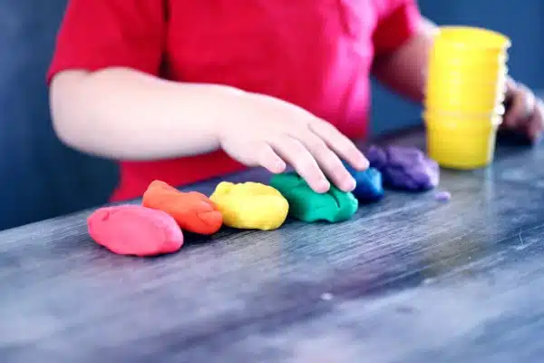 Image of a child playing with clay